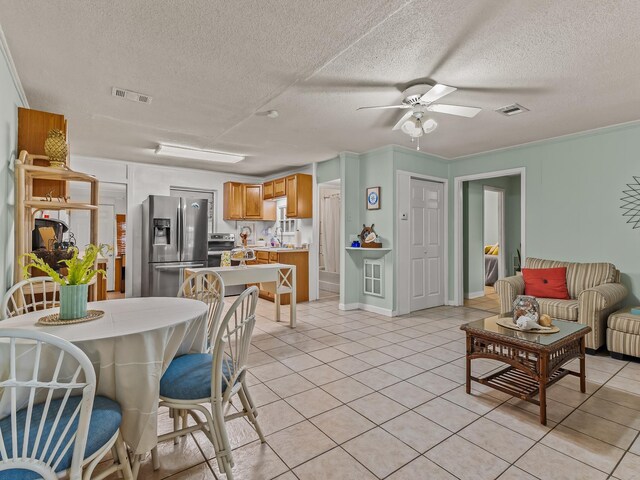 6 Parker Ave Unit 3 & 4, Lanark Village, FL 32323 - dining area with ceiling fan, light tile patterned floors, and a textured ceiling