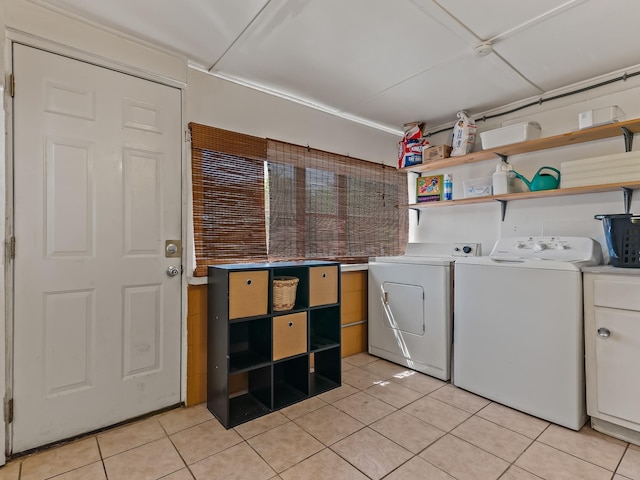 6 Parker Ave Unit 3 & 4, Lanark Village, FL 32323 - laundry area with cabinet space, light tile patterned floors, and washer and clothes dryer