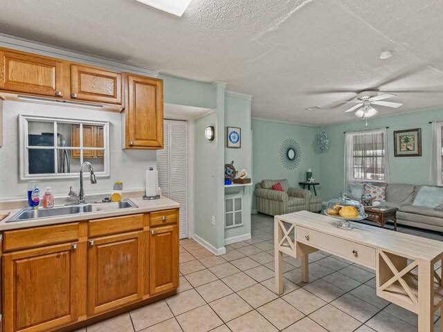 6 Parker Ave Unit 3 & 4, Lanark Village, FL 32323 - kitchen featuring open floor plan, a textured ceiling, ceiling fan, light tile patterned floors, and light countertops