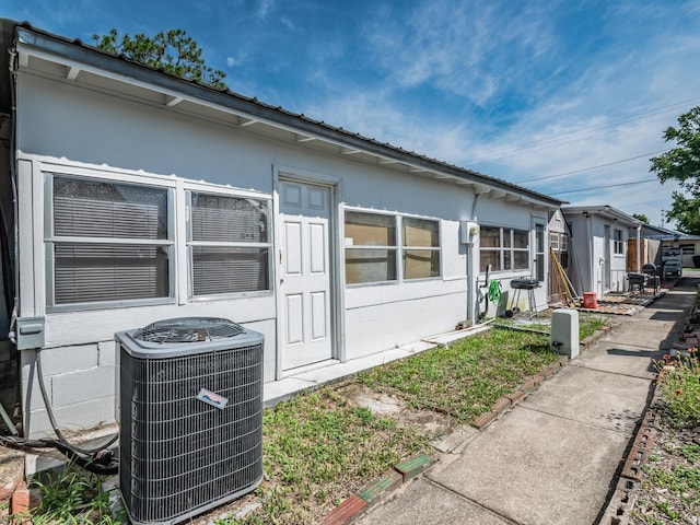 6 Parker Ave Unit 3 & 4, Lanark Village, FL 32323 - view of side of property with a central air condition unit and concrete block siding