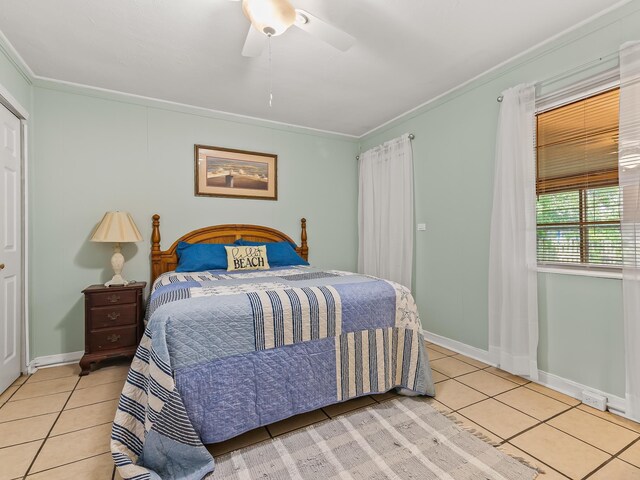 6 Parker Ave Unit 3 & 4, Lanark Village, FL 32323 - bedroom featuring light tile patterned flooring, crown molding, and ceiling fan
