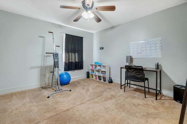 workout room featuring a textured ceiling, ceiling fan, and light carpet