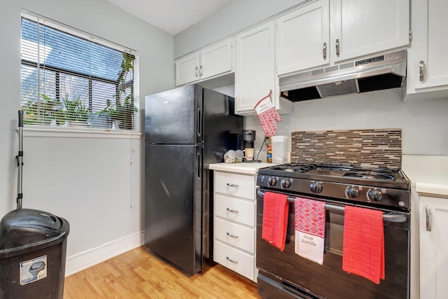 kitchen with black appliances, white cabinets, backsplash, and light hardwood / wood-style flooring