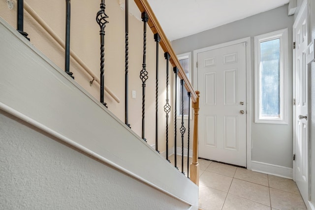 entrance foyer featuring light tile patterned flooring