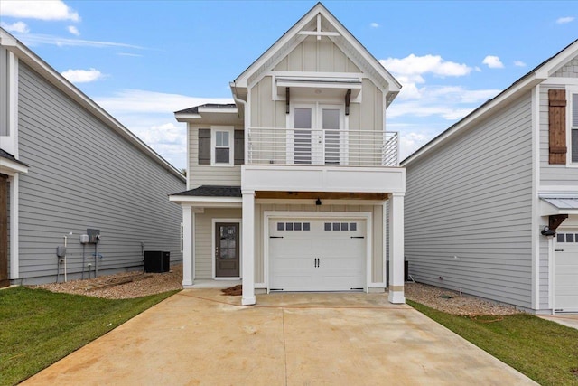 3745 Meadow Vista Ln, Tallahassee, FL 32308 - view of front of property featuring a balcony, board and batten siding, an attached garage, and concrete driveway