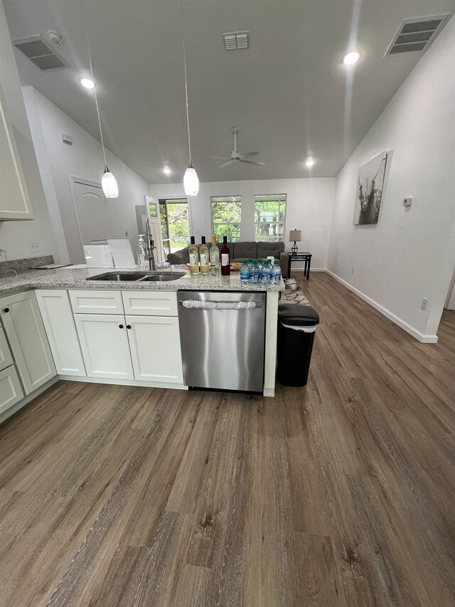 kitchen with white cabinetry, stainless steel dishwasher, and dark hardwood / wood-style floors