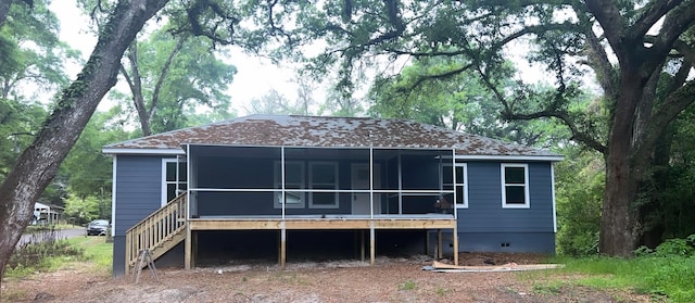 back of property featuring a sunroom