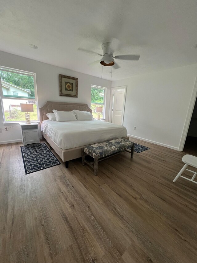 bedroom featuring ceiling fan and dark hardwood / wood-style floors