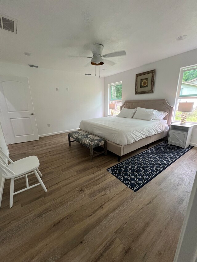 bedroom featuring dark wood-type flooring and ceiling fan