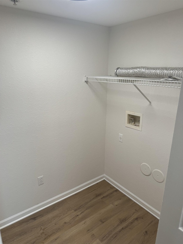 laundry area featuring dark hardwood / wood-style floors and hookup for a washing machine