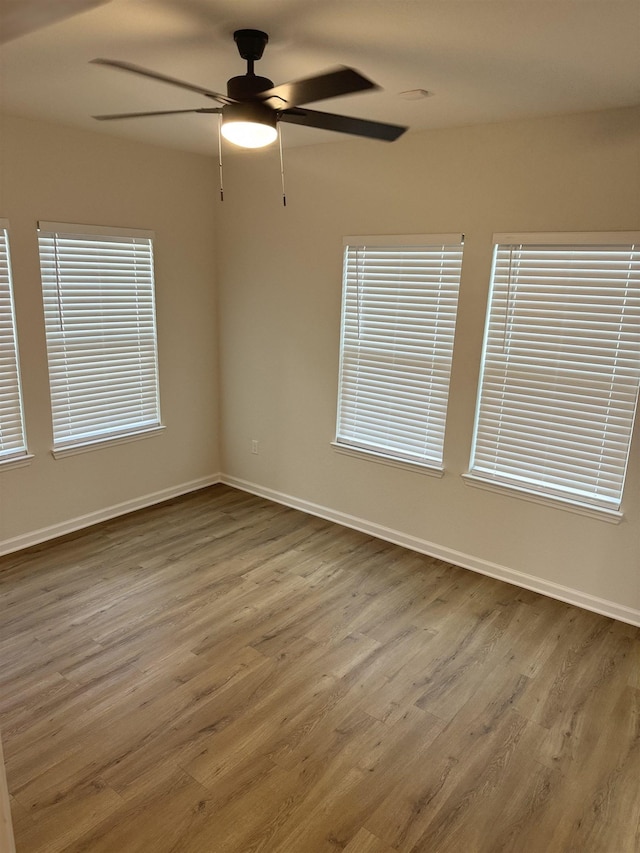 empty room with hardwood / wood-style flooring