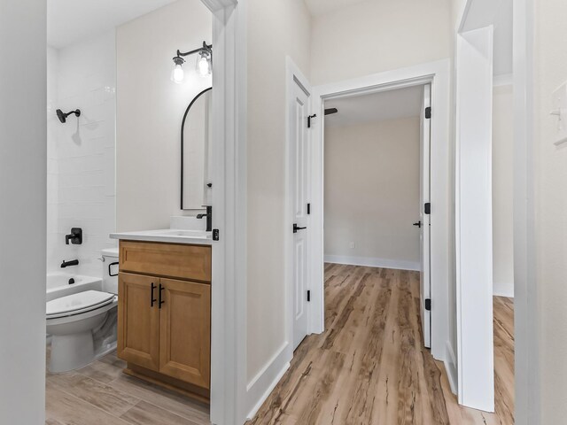 117 Anhinga Trl, Carrabelle, FL 32322 - full bath with vanity, wood finished floors, and tub / shower combination