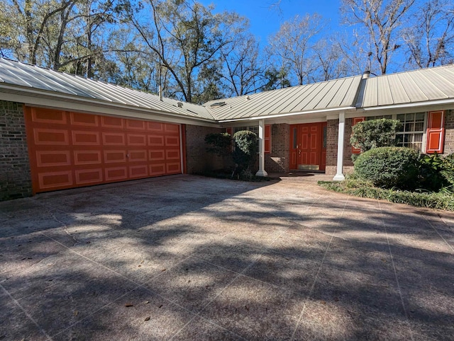 ranch-style house featuring a garage