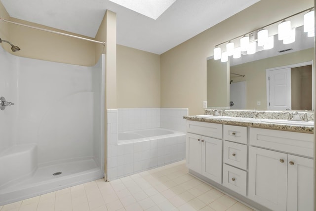 1790 Newman Ln, Tallahassee, FL 32312 - full bath with tile patterned flooring, a shower, a skylight, and double vanity