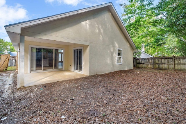 1790 Newman Ln, Tallahassee, FL 32312 - back of property with a patio, a fenced backyard, and stucco siding