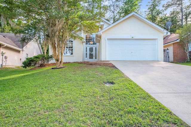 1790 Newman Ln, Tallahassee, FL 32312 - view of front facade featuring concrete driveway, a front yard, an attached garage, stucco siding, and french doors