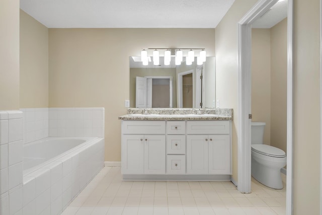 1790 Newman Ln, Tallahassee, FL 32312 - full bath featuring a bath, double vanity, toilet, tile patterned flooring, and baseboards