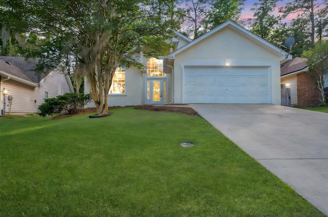 1790 Newman Ln, Tallahassee, FL 32312 - view of front of property featuring driveway, a front yard, an attached garage, and stucco siding