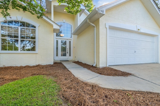 1790 Newman Ln, Tallahassee, FL 32312 - entrance to property with stucco siding, a garage, and concrete driveway