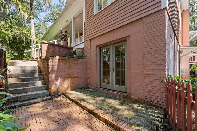 727 Miccosukee Rd -, Unit Tallahassee, FL 32308 - view of exterior entry featuring french doors, a patio area, and brick siding