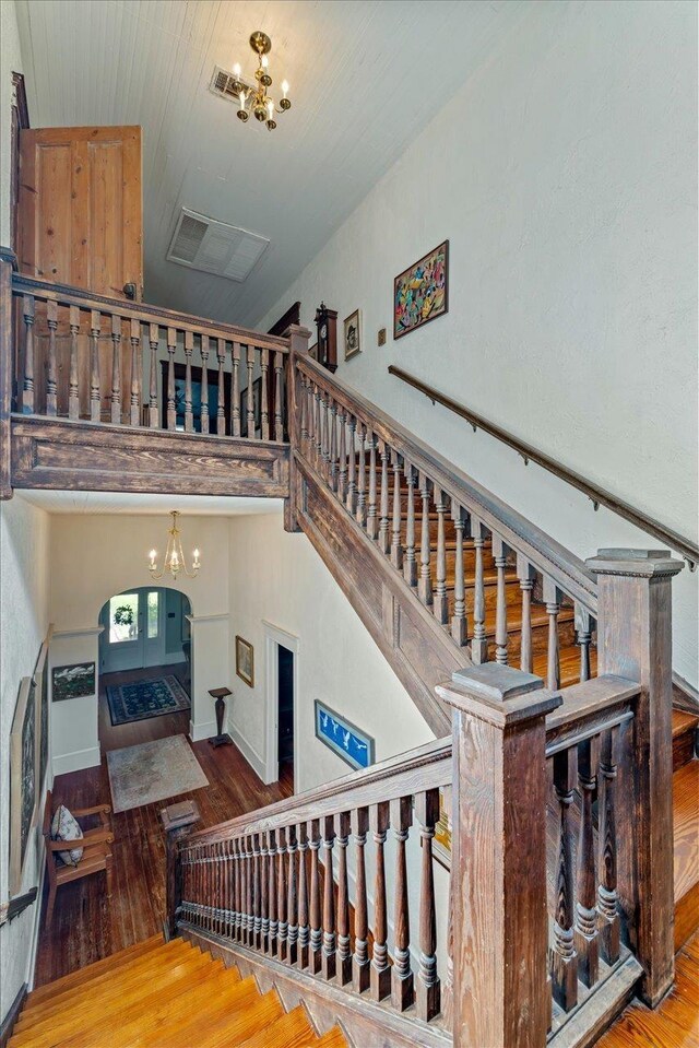 727 Miccosukee Rd -, Unit Tallahassee, FL 32308 - stairway featuring a chandelier and wood-type flooring