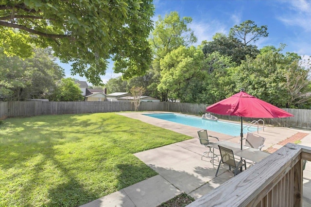 view of swimming pool with a fenced backyard, a patio, a fenced in pool, and a lawn