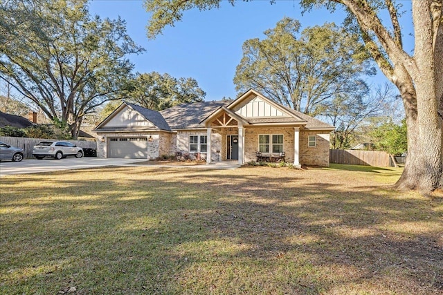 view of front of home featuring a garage, driveway, fence, a front lawn, and board and batten siding