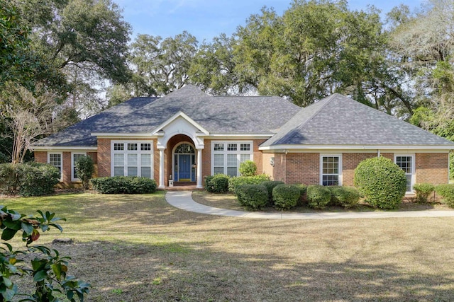 ranch-style home with a front yard