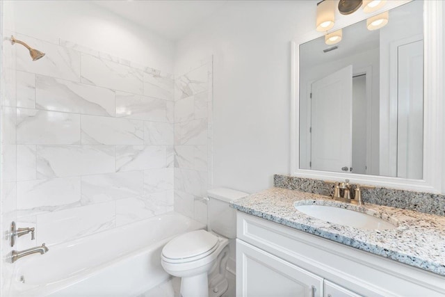 full bathroom with tiled shower / bath combo, toilet, and vanity