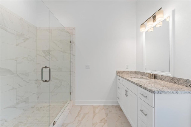 bathroom featuring vanity and an enclosed shower