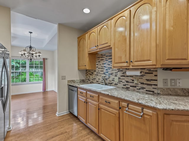 944 Poser Ct, Tallahassee, FL 32317 - kitchen featuring stainless steel appliances, decorative backsplash, light wood finished floors, and a chandelier