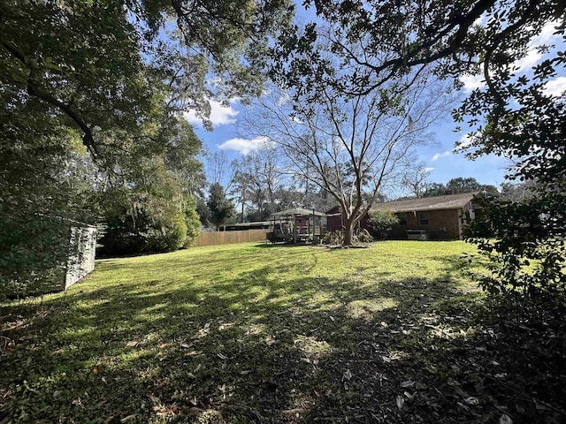 view of yard featuring fence