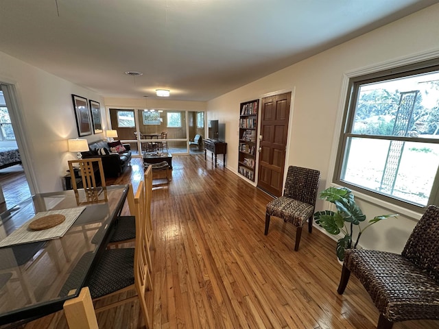 interior space featuring plenty of natural light, wood finished floors, and visible vents