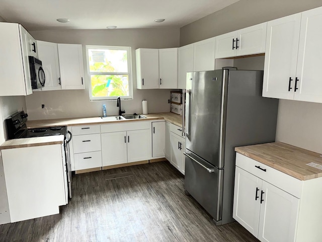 kitchen featuring black appliances, white cabinets, and sink