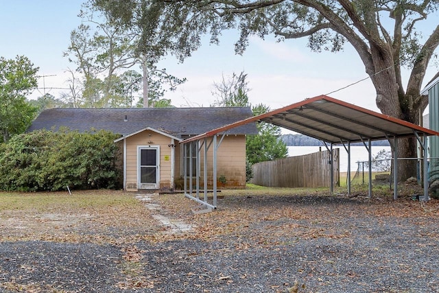 view of front of property featuring a carport