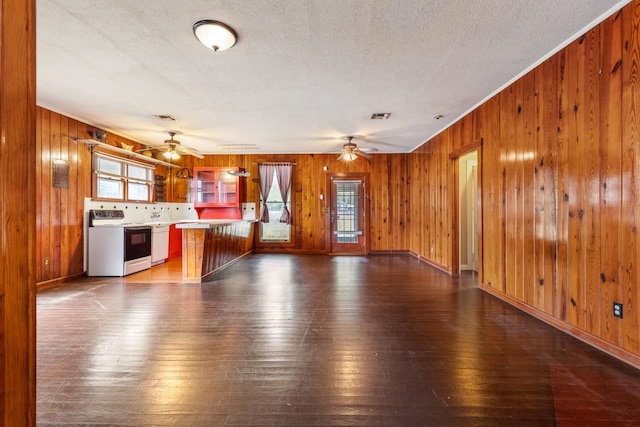 kitchen featuring white appliances, dark wood-type flooring, kitchen peninsula, and ceiling fan