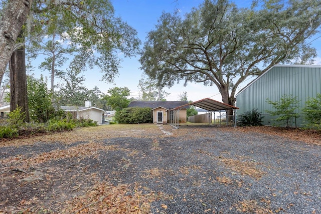 ranch-style home featuring a carport