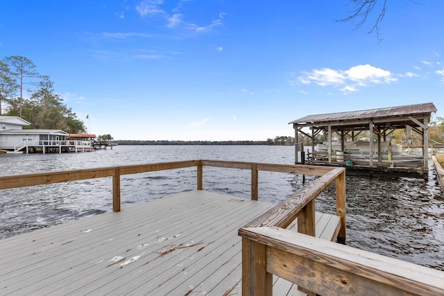 dock area with a water view