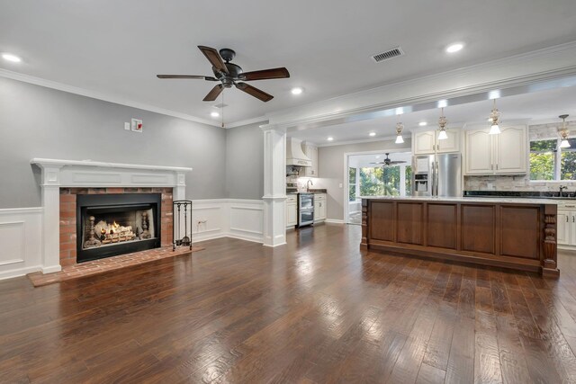 2953 Velda Dairy Rd, Tallahassee, FL 32309 - kitchen featuring stainless steel refrigerator with ice dispenser, ceiling fan, open floor plan, a brick fireplace, and dark wood-type flooring