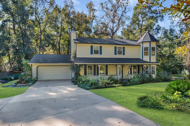 2953 Velda Dairy Rd, Tallahassee, FL 32309 - victorian house with covered porch, an attached garage, a chimney, concrete driveway, and a front lawn