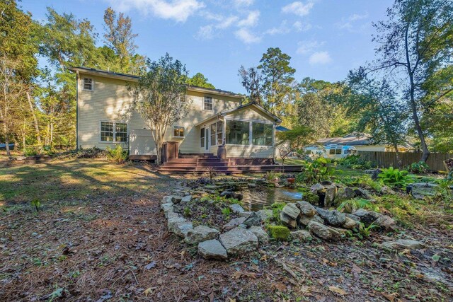 2953 Velda Dairy Rd, Tallahassee, FL 32309 - rear view of property featuring a sunroom and a deck