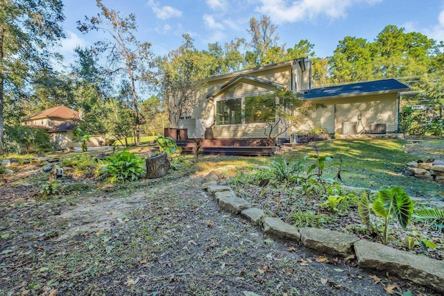 2953 Velda Dairy Rd, Tallahassee, FL 32309 - rear view of house with a wooden deck and a chimney