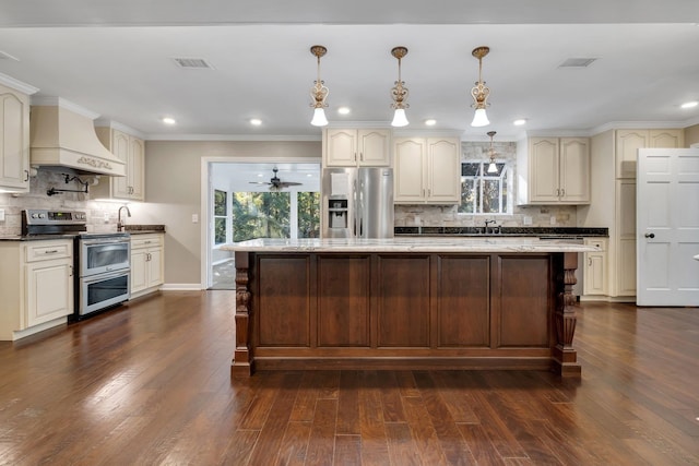 kitchen featuring dark wood finished floors, tasteful backsplash, visible vents, custom exhaust hood, and stainless steel appliances
