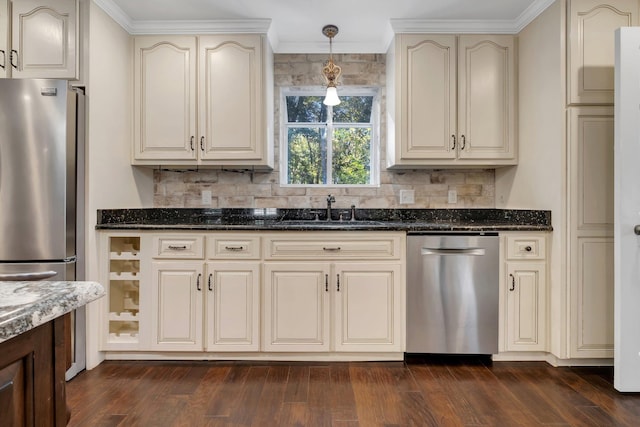 2953 Velda Dairy Rd, Tallahassee, FL 32309 - kitchen featuring stainless steel appliances, cream cabinets, ornamental molding, and dark wood-type flooring