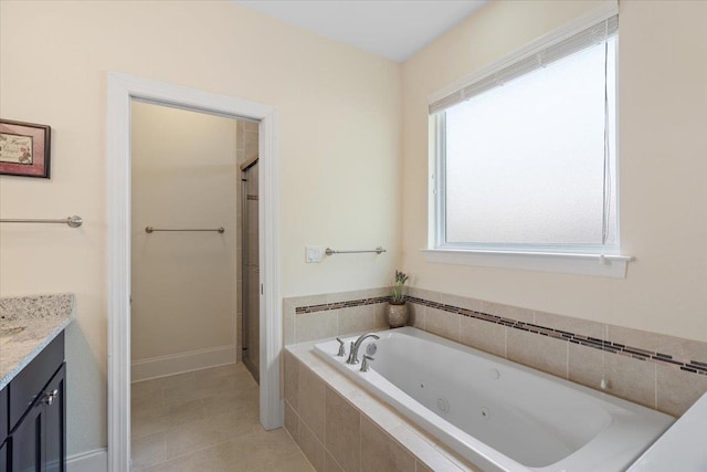 4516 Cavendish Ct, Tallahassee, FL 32309 - full bath with vanity, a jetted tub, a stall shower, and tile patterned flooring