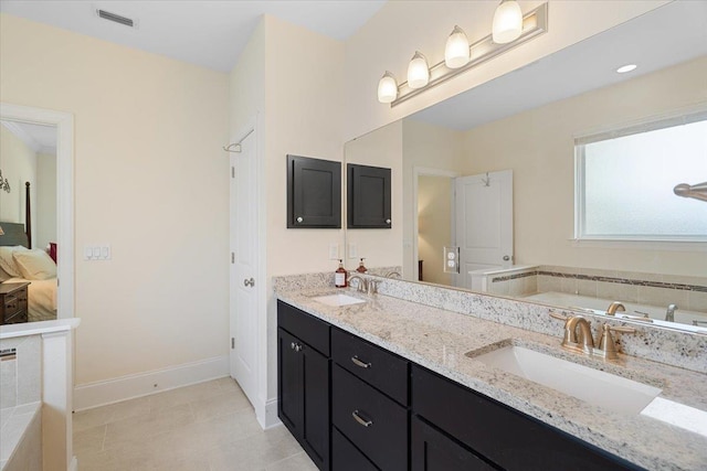 4516 Cavendish Ct, Tallahassee, FL 32309 - full bathroom featuring a bath, double vanity, and tile patterned flooring