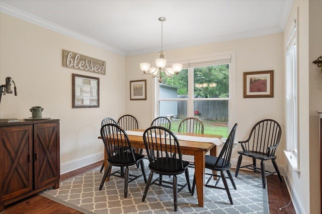 4516 Cavendish Ct, Tallahassee, FL 32309 - dining room featuring dark wood-style floors, crown molding, and a chandelier