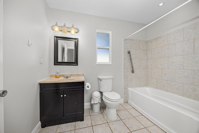 full bathroom featuring vanity, tile patterned flooring, toilet, and tiled shower / bath combo