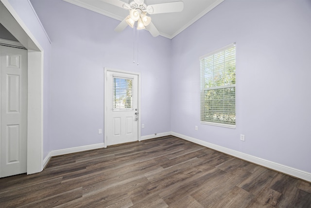 unfurnished room with ceiling fan, plenty of natural light, ornamental molding, and dark hardwood / wood-style floors