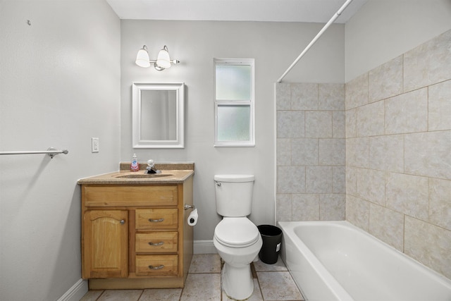 full bathroom featuring toilet, vanity, tile patterned floors, and tiled shower / bath